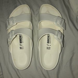 white plastic birkenstocks